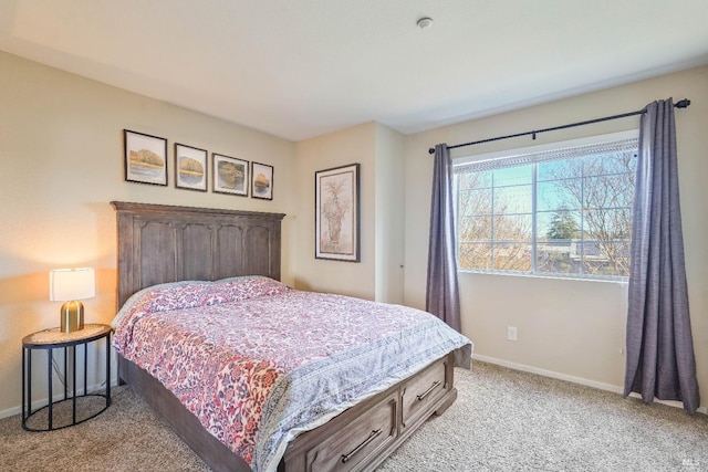 bedroom featuring baseboards and light colored carpet