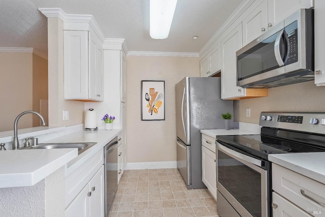 kitchen with a sink, light countertops, a peninsula, and stainless steel appliances