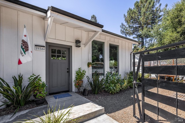 entrance to property featuring board and batten siding