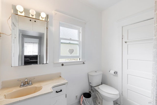 bathroom with vanity and toilet