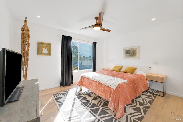 bedroom featuring light wood-type flooring, baseboards, and recessed lighting