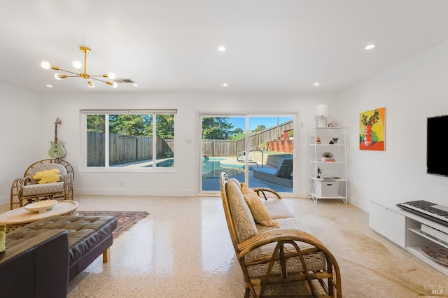 living area featuring a healthy amount of sunlight, visible vents, a chandelier, and recessed lighting