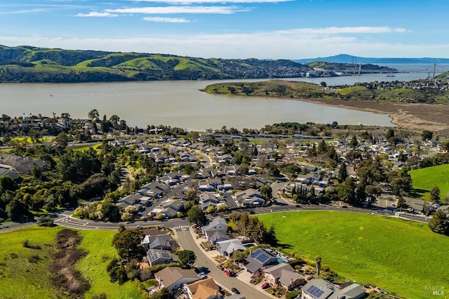 bird's eye view featuring a water view and a residential view