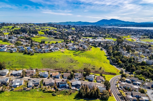 drone / aerial view featuring a residential view and a mountain view