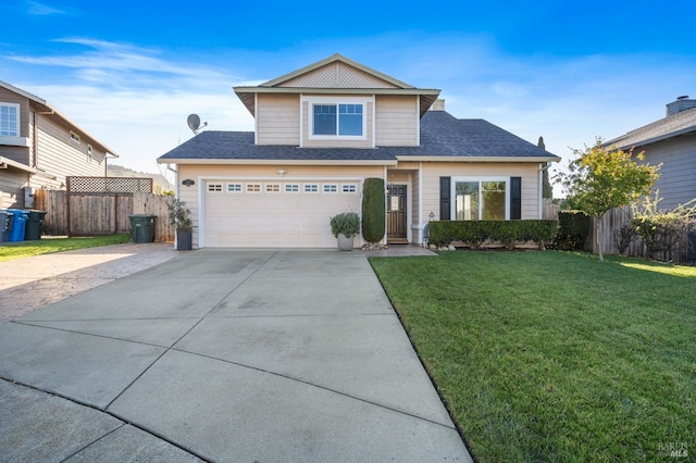 view of front facade featuring an attached garage, fence, a front lawn, and concrete driveway