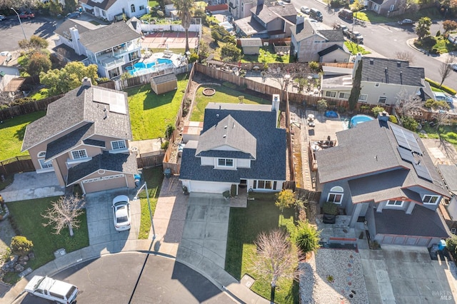 birds eye view of property with a residential view