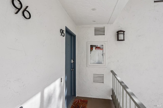 entrance to property with stucco siding