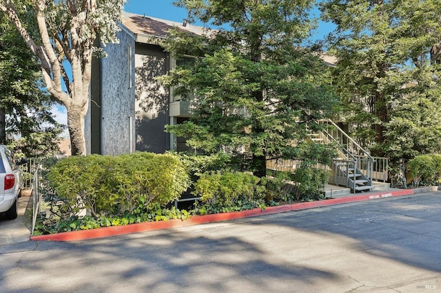 view of building exterior with stairs