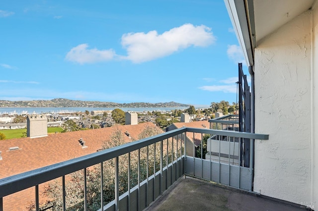 balcony featuring a water view