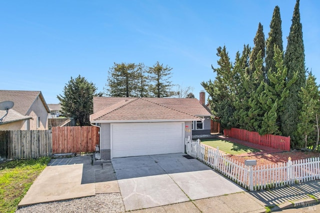 single story home featuring a chimney, an attached garage, concrete driveway, and fence