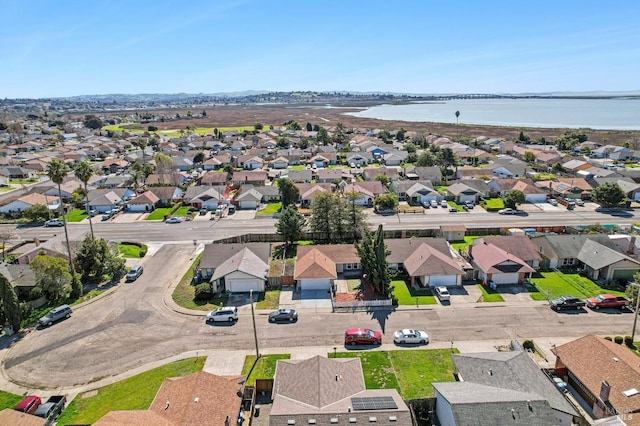 bird's eye view featuring a residential view and a water view