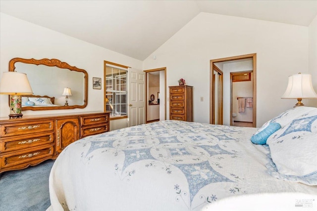 bedroom with carpet flooring and vaulted ceiling