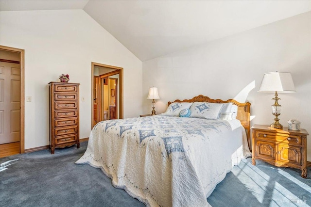 bedroom with lofted ceiling, carpet flooring, and baseboards