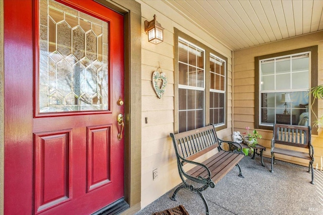 doorway to property with covered porch