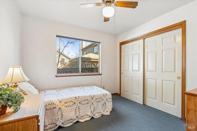 bedroom featuring a closet, dark carpet, and ceiling fan