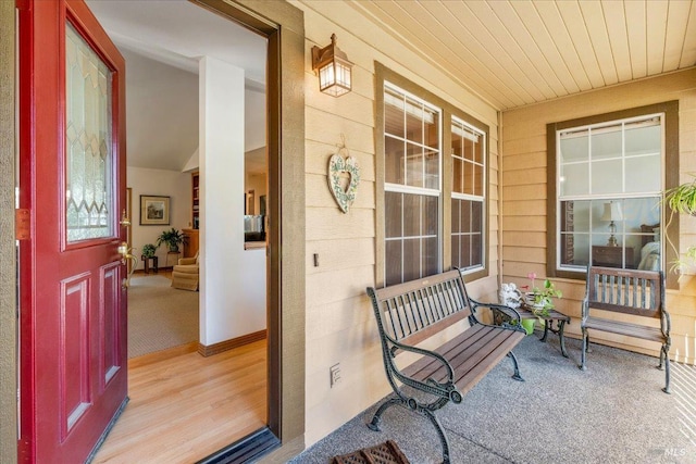 entrance to property featuring covered porch