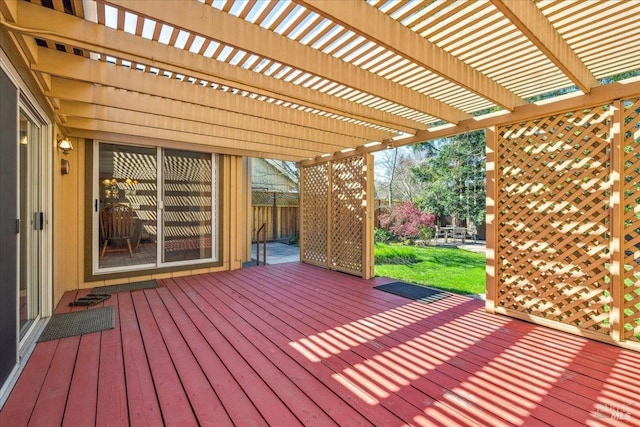 deck with fence and a pergola