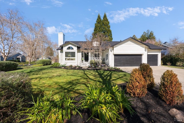 single story home with a garage, driveway, a front lawn, and a chimney