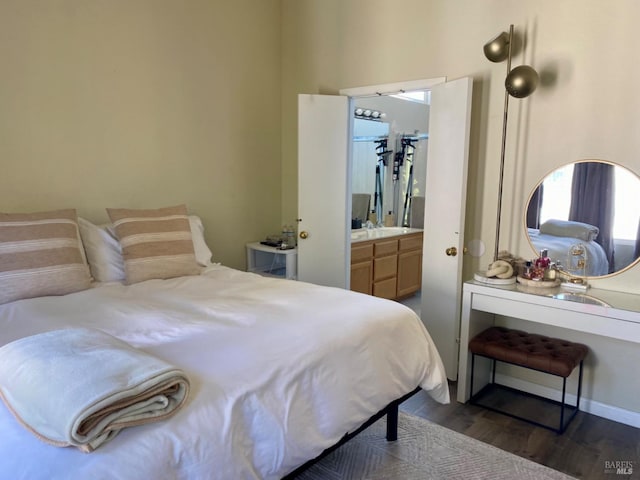 bedroom featuring dark wood-style floors and baseboards