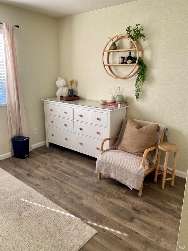 sitting room with wood finished floors and baseboards