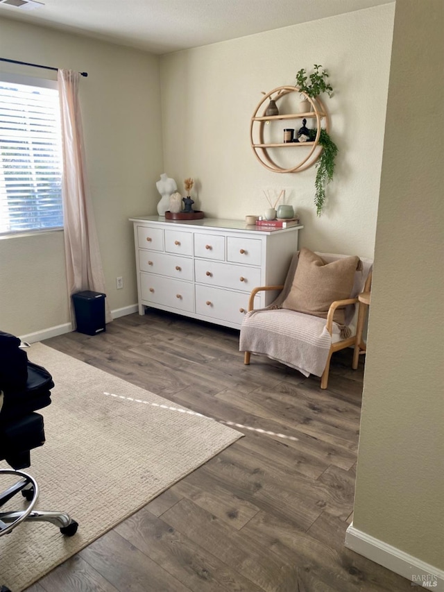 living area featuring dark wood-style floors and baseboards