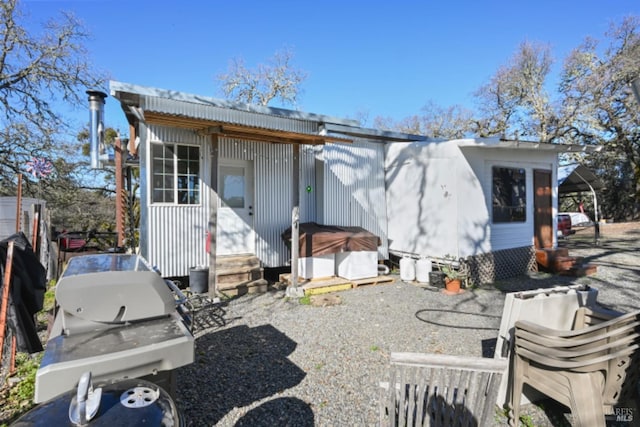 back of house with entry steps