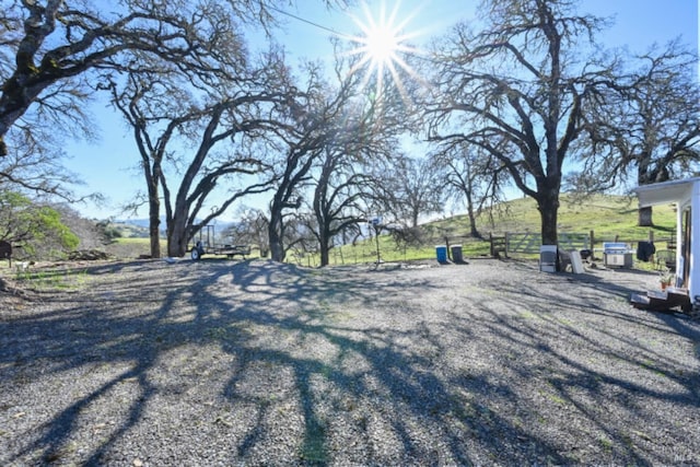 view of road featuring gravel driveway