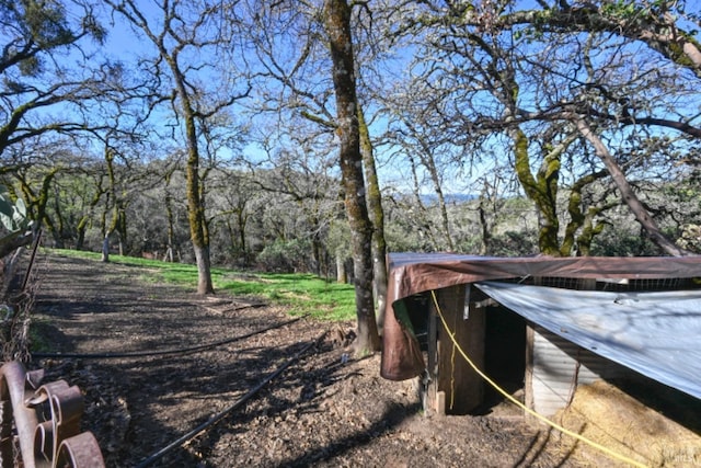 exterior space with a forest view