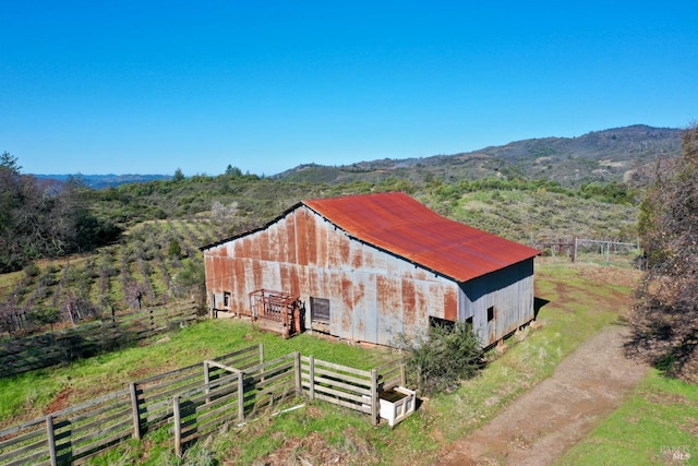 exterior space with a rural view and a mountain view