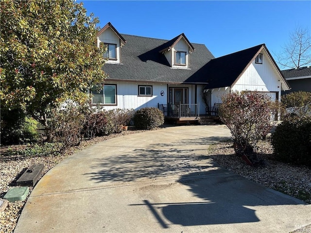 view of front facade featuring concrete driveway and roof with shingles