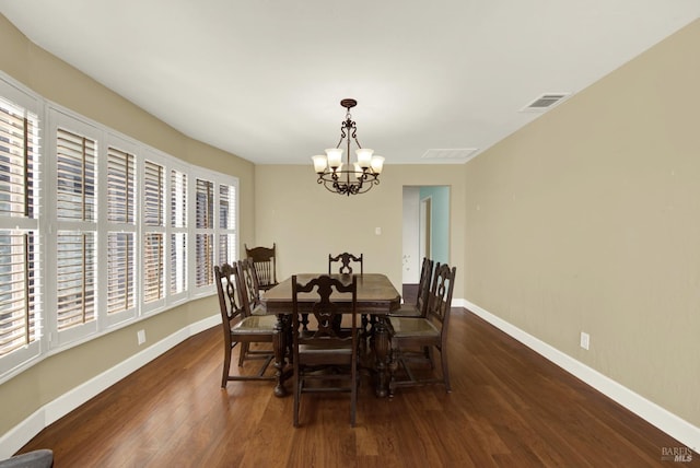 dining area with an inviting chandelier, wood finished floors, visible vents, and baseboards