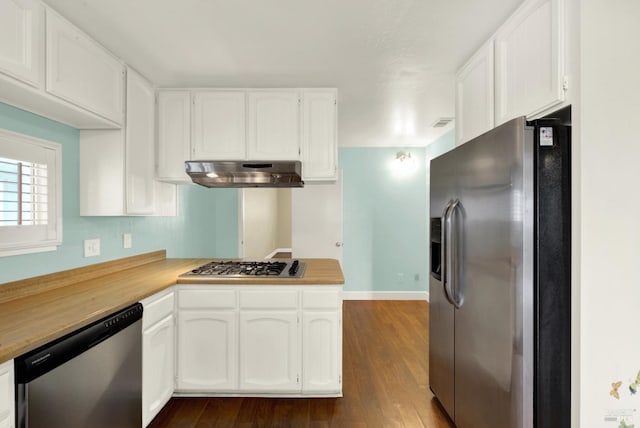 kitchen with light countertops, appliances with stainless steel finishes, dark wood-type flooring, white cabinets, and under cabinet range hood