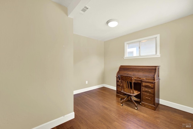 home office featuring baseboards, visible vents, and wood finished floors