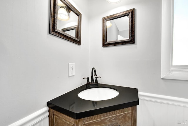 bathroom featuring vanity and wainscoting