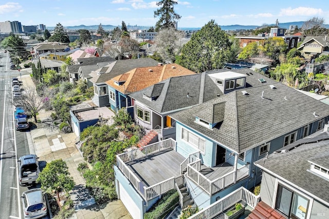 birds eye view of property with a mountain view and a residential view