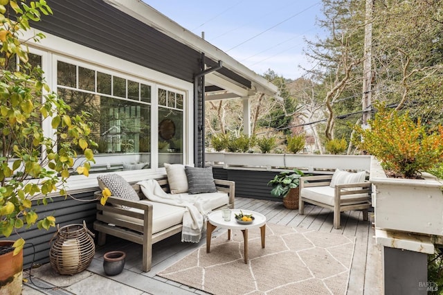 view of patio / terrace with a deck and an outdoor living space