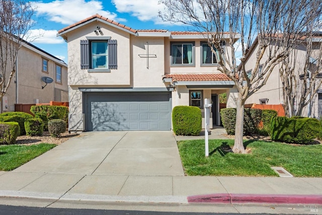 mediterranean / spanish-style home featuring stucco siding, concrete driveway, a tile roof, and an attached garage