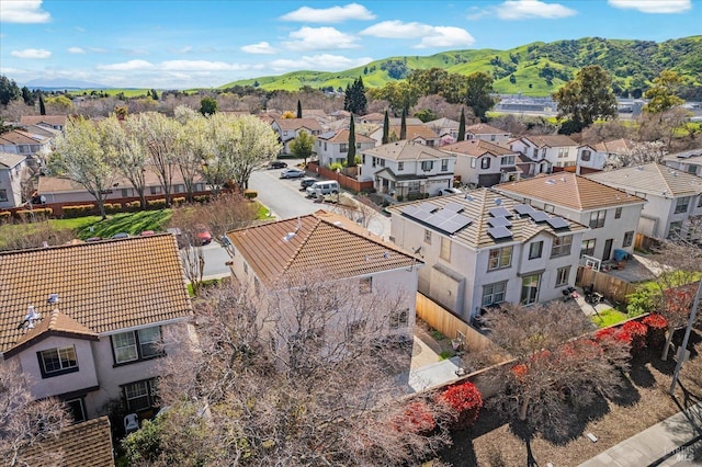 drone / aerial view featuring a mountain view and a residential view