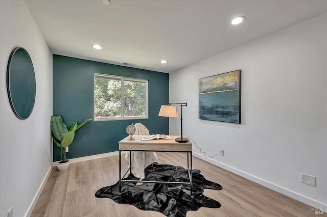 office space featuring recessed lighting, visible vents, baseboards, and wood finished floors