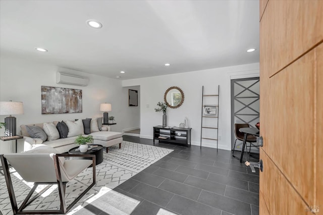 living room with dark tile patterned floors, recessed lighting, baseboards, and a wall mounted air conditioner