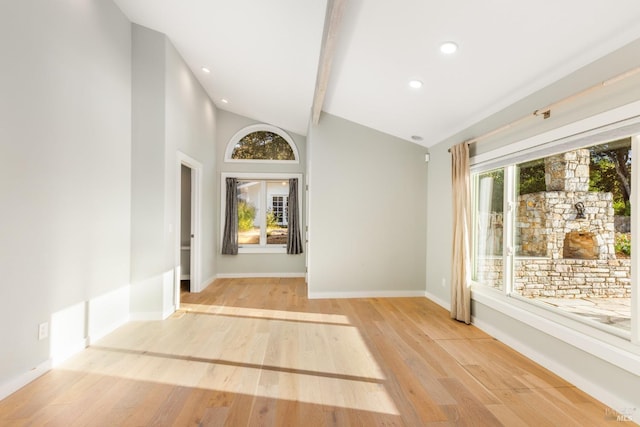 foyer with high vaulted ceiling, recessed lighting, baseboards, and wood finished floors