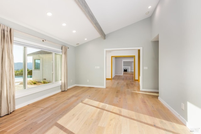 unfurnished room featuring light wood-style flooring, recessed lighting, lofted ceiling with beams, and baseboards