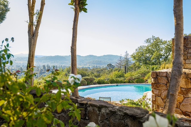 outdoor pool with a mountain view