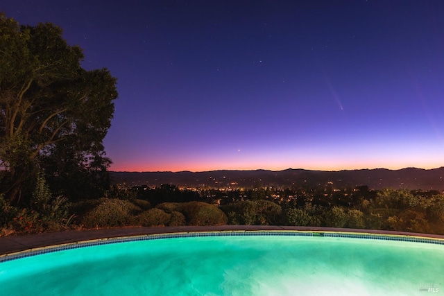 outdoor pool featuring a mountain view