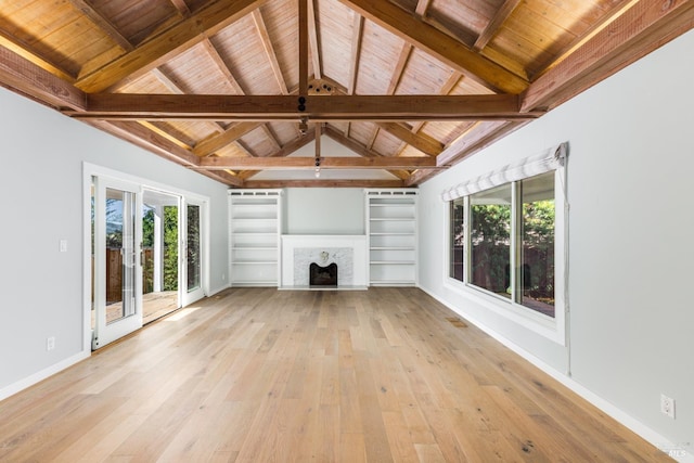 unfurnished living room with light wood finished floors, baseboards, a fireplace with raised hearth, wooden ceiling, and vaulted ceiling with beams