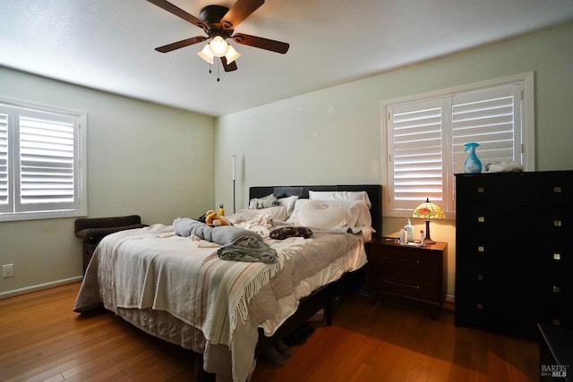 bedroom featuring hardwood / wood-style flooring and ceiling fan