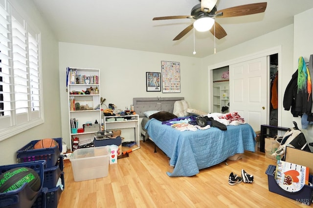 bedroom featuring a closet, ceiling fan, and wood finished floors