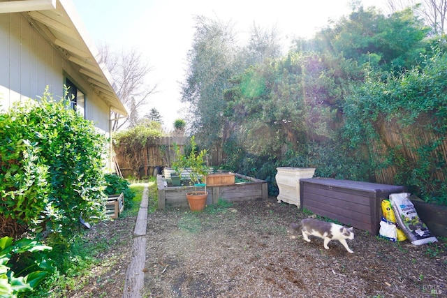 view of yard with a garden and fence