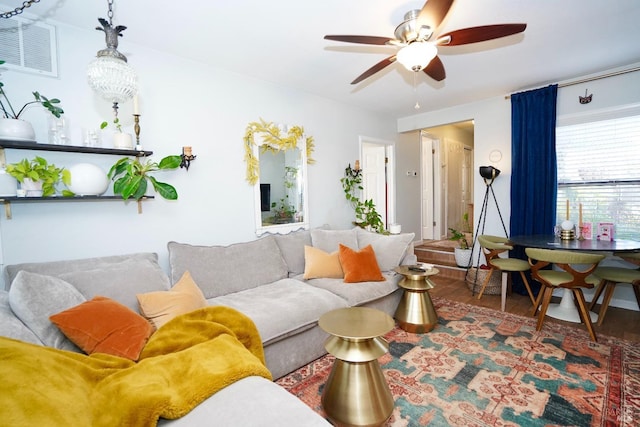 living area featuring ceiling fan and wood finished floors