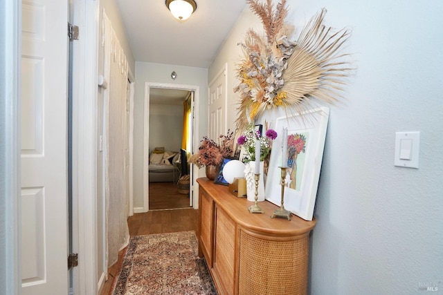 hall with wood finished floors